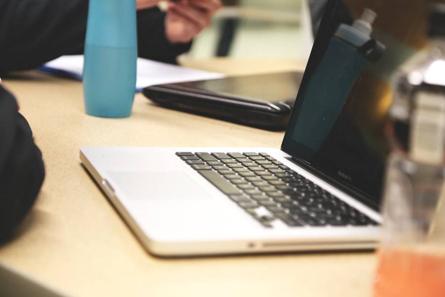 Social Media Marketing Laptop On A Desk In A Collaborative Meeting Workspace For Social Media Content Management